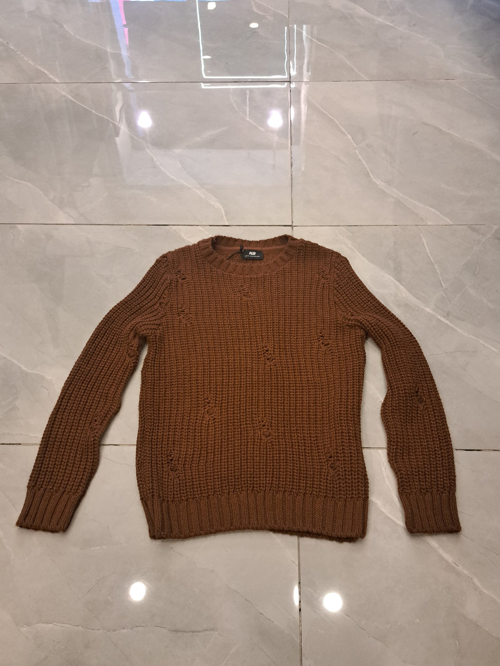 Maglione con rotture